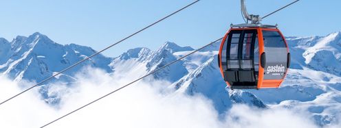 In knalligem orange leuchten die Kabinen der neuen Schlossalm-Bahn