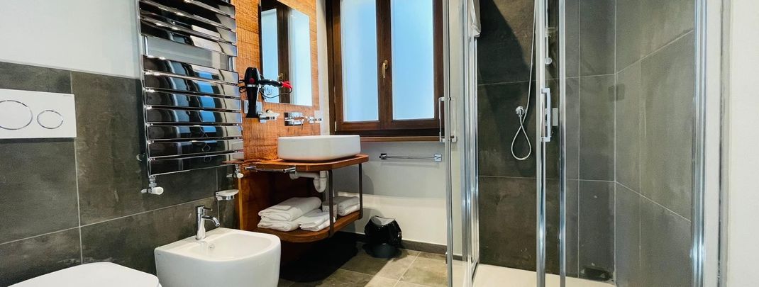 Bathroom with shower and bidet