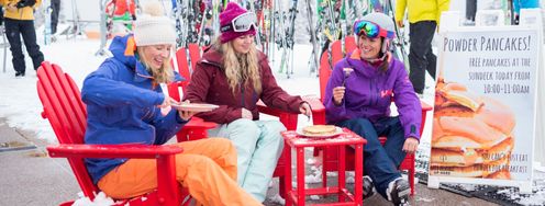 Skiers enjoy free pancakes with fresh snow in Aspen.
