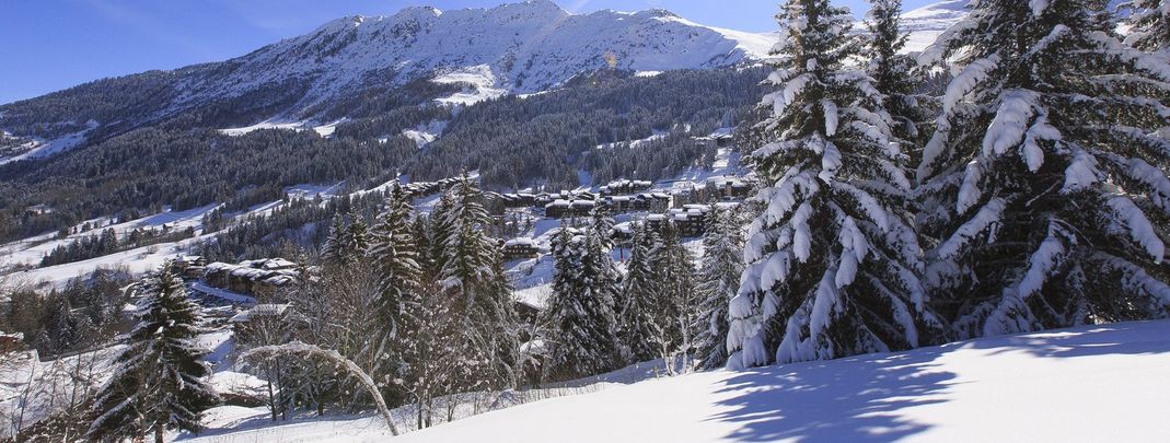 The idyllic ski resort Valmorel amidst the snowy winter landscape.