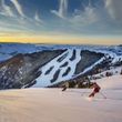 Carve across the freshly groomed pistes at sunrise.