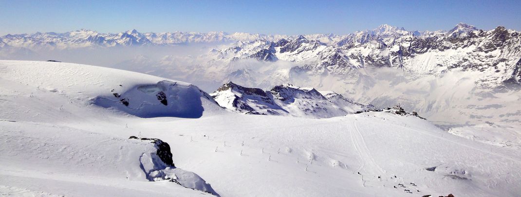 View from Klein Matterhorn over the t-bars on Theodul glacier and the border to Italy on Testa Grigia.
