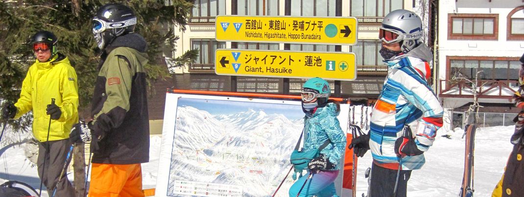 Signage and piste map in the valley