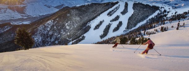 Carve across the freshly groomed pistes at sunrise.