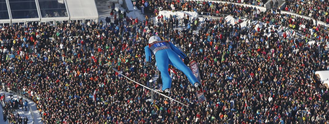 Many spectators in the stadiums at the Four-Hills-Tournament.