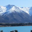 View of the glacial lake Ohau with Ohau ski field in the background.