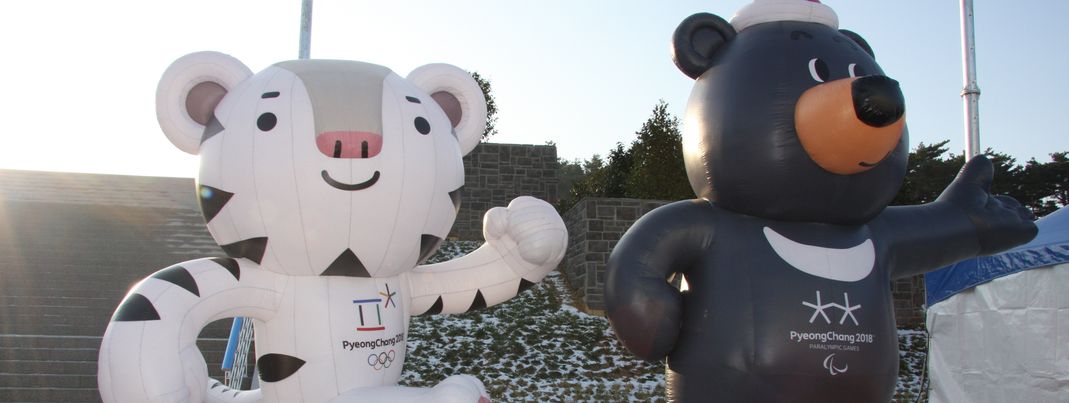 Guess who's already smiling down from huge billboards: The white tiger Soohorang and the black bear Bandabi are the Winter Olympics' mascots.