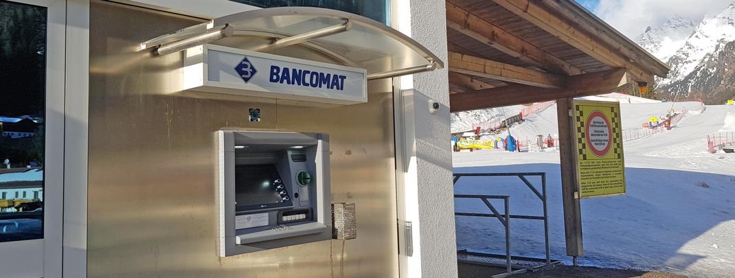 There is an ATM right next to the parking lot.