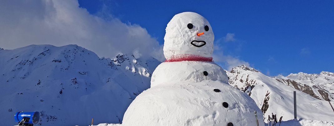 A big snowman at the top station of the