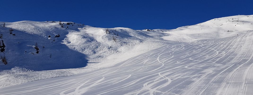 The wide slopes invite you to carve.