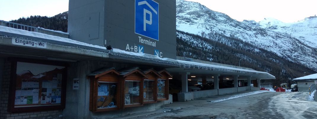 The parking garage is located at the entrance to the village.