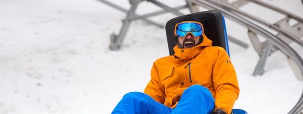 The 4,800-foot-long alpine mountain coaster Beast Mountain Coaster twists and turns through the woods.