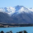 View of the glacial lake Ohau with Ohau ski field in the background.