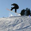 Snowboarders enjoy the integrated fun park in the skiing area