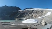 Archiviertes Webcam Bild: Sölden Rettenbachgletscher: Weltcuptribüne und Talstation am 12.07.2026 um 08:15 Uhr