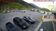 Archived webcam image showing Andermatt – Parking area Gemsstock Ropeway on 21 Sep 2026 at 08:15