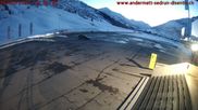 Archived webcam image showing Andermatt – Parking area Gemsstock Ropeway on 26 Feb 2026 at 18:34