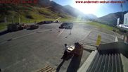 Archived webcam image showing Andermatt – Parking area Gemsstock Ropeway on 12 Oct 2026 at 16:02