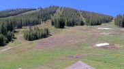 Archived webcam image showing Winter Park Eskimo Chairlift and Snoasis Restaurant on 11 Jun 2026 at 18:34