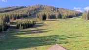 Archived webcam image showing Winter Park Eskimo Chairlift and Snoasis Restaurant on 27 Jun 2026 at 14:12