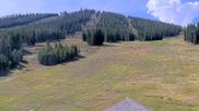 Archived webcam image showing Winter Park Eskimo Chairlift and Snoasis Restaurant on 27 Aug 2026 at 18:20