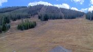 Archived webcam image showing Winter Park Eskimo Chairlift and Snoasis Restaurant on 25 Oct 2026 at 22:21