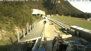 Archiviertes Webcam Bild: Eisarena Königssee: Blick auf die Bobbahn in Schönau am 29.06.2026 um 07:35 Uhr