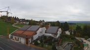 Archived webcam image showing Hopfensee - View to Reutte-Hahnenkamm ski resort on 30 Oct 2026 at 12:32