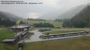 Archived webcam image showing Obertilliach biathlon centre on 30 Jun 2026 at 07:42