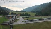 Archived webcam image showing Obertilliach biathlon centre on 30 Jun 2026 at 08:42