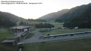 Archived webcam image showing Obertilliach biathlon centre on 26 Aug 2026 at 06:34