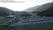 Archived webcam image showing Obertilliach biathlon centre on 26 Aug 2026 at 07:34