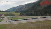 Archived webcam image showing Obertilliach biathlon centre on 15 Oct 2026 at 14:10