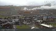 Archived webcam image showing Livigno: Ski School Area and Tagliede Gondola on 21 Oct 2026 at 11:49