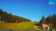 Archived webcam image showing Base station of t-bar lift in ski resort Jauerling on 24 Apr 2026 at 06:14