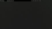 Archived webcam image showing Engelberg: Lake Härzlisee & mountain restaurant Kräuterhütte on 12 May 2026 at 00:53