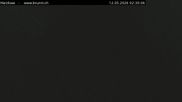 Archived webcam image showing Engelberg: Lake Härzlisee & mountain restaurant Kräuterhütte on 12 May 2026 at 02:53