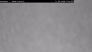 Archived webcam image showing Engelberg: Lake Härzlisee & mountain restaurant Kräuterhütte on 12 May 2026 at 07:53