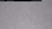 Archived webcam image showing Engelberg: Lake Härzlisee & mountain restaurant Kräuterhütte on 12 May 2026 at 08:53
