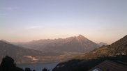 Archived webcam image showing View of Thunsersee, Niesen mountain (2362m) and Kander valley on 12 Jul 2026 at 06:12