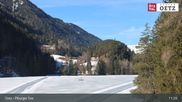 Archived webcam image showing Oetztal: View Lake Piburg on 26 Feb 2026 at 11:17