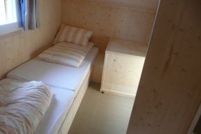 2nd bedroom with 2 single beds and storage