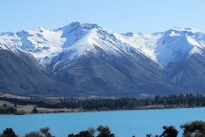 View of the glacial lake Ohau with Ohau ski field in the background.