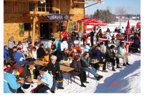 The large sun terrace with a view of the slopes and the children's slide paradise