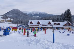 In the children fun park, magic carpets help with the first turns in the snow.