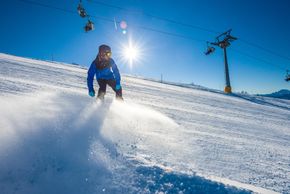 Boarders and freeriders enjoy both the groomed slopes and the ski area's natural runs and deep-snow descents.