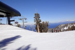 View of Gunbarrel Express Lift with Lake Tahoe in the background.