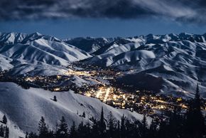 The village of Sun Valley is surrounded by snow-covered mountains in winter.