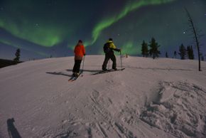 In Finnish Lapland, the green glowing northern lights shine.