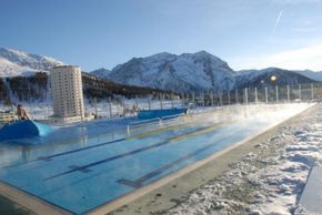 In the background stands one of the two towers that dominate the village's skyline